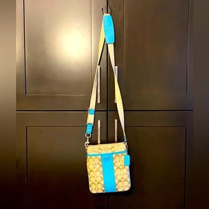 COACH beige crossbody bag with blue accents